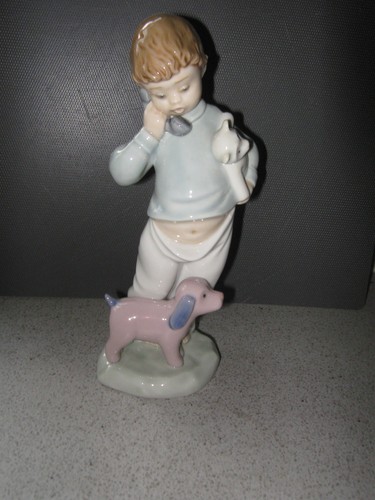 Nao lladro 1044 boy on - by,